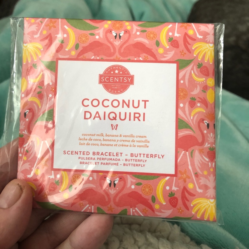 Scentsy coconut daiquiri scented butterfly bracelet. New in package.